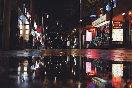 people on the streets during nighttime thumbnail