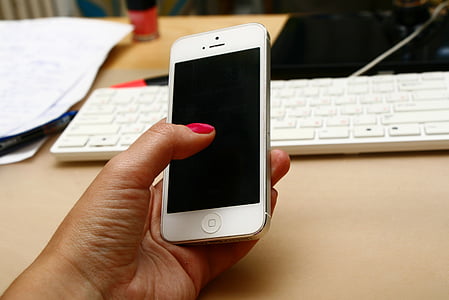 person holding white iPhone 5 thumbnail
