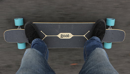 person on black Goat long board thumbnail