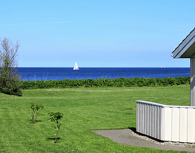 white sail boat in the sea under clear sky thumbnail