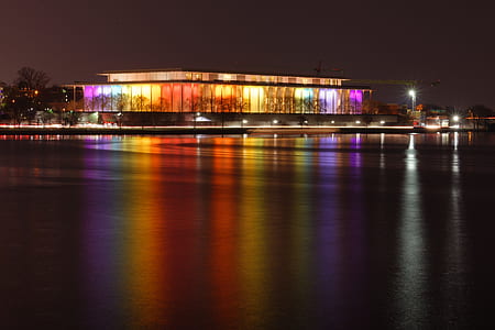 lighted glass building during nighttime thumbnail
