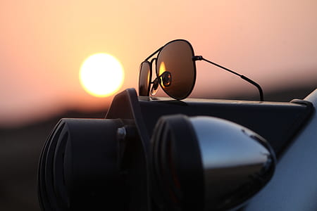 selective focus photography of black aviator-style sunglasses thumbnail