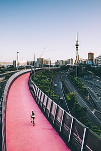 man riding bicycle on fly over roadway thumbnail