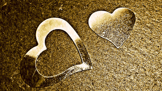 two heart glass decor on brown surface thumbnail
