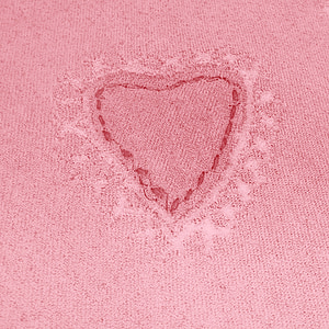 red textile with embroidered heart thumbnail