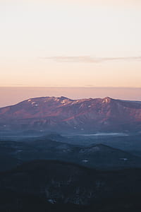 mountain under white sky at daytime thumbnail