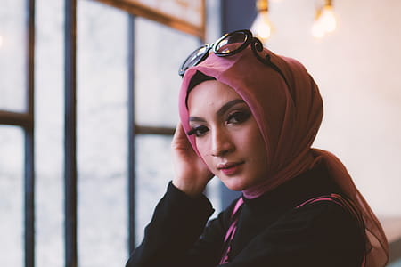 Woman in Pink Headdress With Sunglasses on Her Head thumbnail