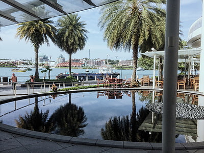 calm swimming pool near building and sea at daytime thumbnail