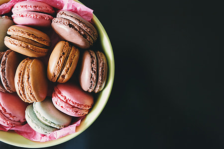 Macarons in a bowl on a dark background thumbnail