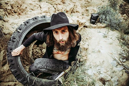 man inside tire and soil thumbnail