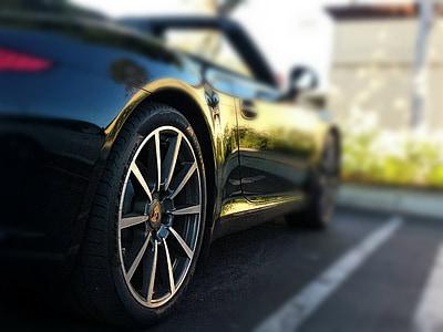 selective focus photography of black Porsche convertible coupe thumbnail