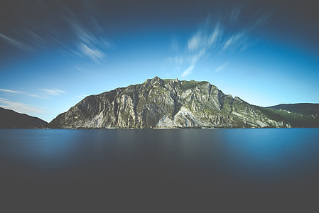 landscape photo of gray mountain near body of water thumbnail