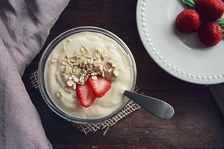 cream with strawberry on white ceramic bowl thumbnail