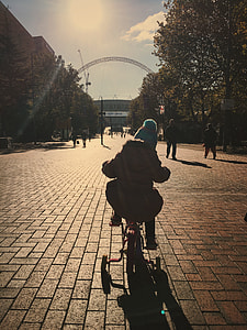 child ride on training bicycle during day time thumbnail