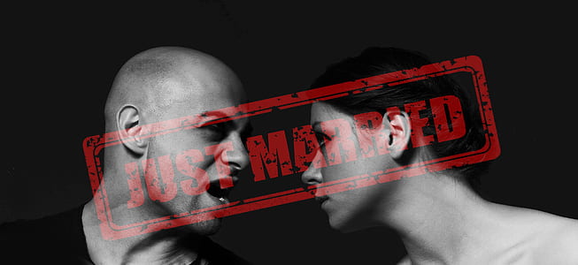 gray scale photo of woman and man on black background thumbnail