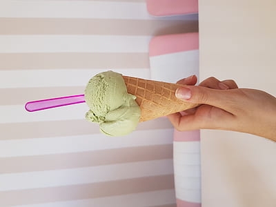 person holding ice cream on cone thumbnail
