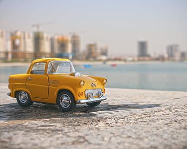 yellow die-cast coupe toy car thumbnail