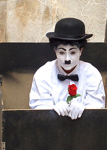 man in white dress shirt and Charlie Chaplin makeup thumbnail