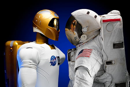 two people wearing white and gold helmets thumbnail
