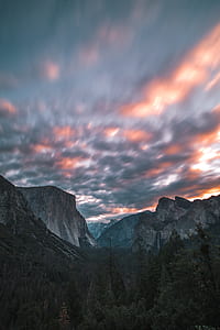 mountains under cloudy sky thumbnail