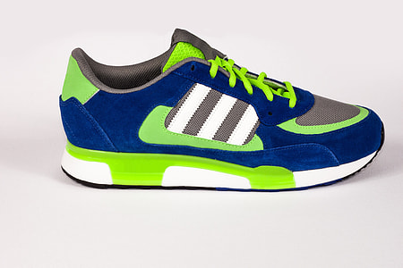 unpaired blue, green, and gray Adidas low-top athletic shoe thumbnail