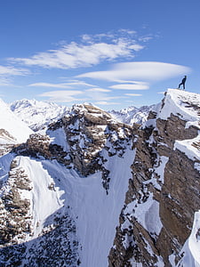person standing on brown mountain thumbnail