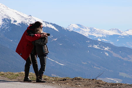 person hugging another person near cliff thumbnail