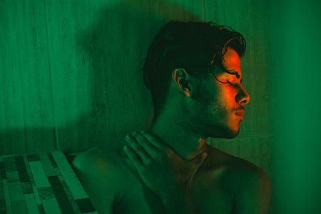 topless man holding neck thumbnail
