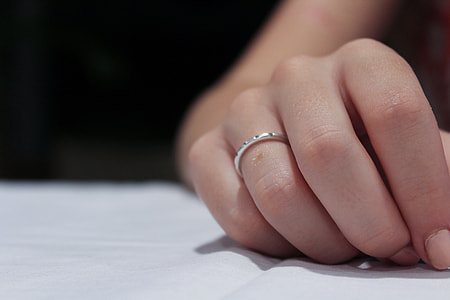person wearing silver ring thumbnail
