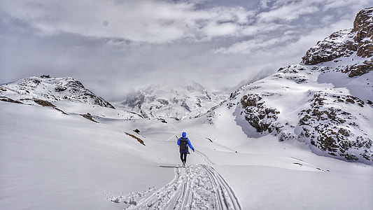 person waling on snow covered trail thumbnail