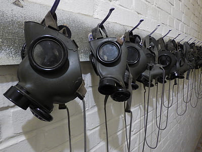 gray gas masks on hooks thumbnail