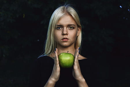 woman holding green apple fruit thumbnail