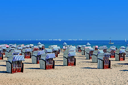 blue-and-white tents near shore during daytime thumbnail