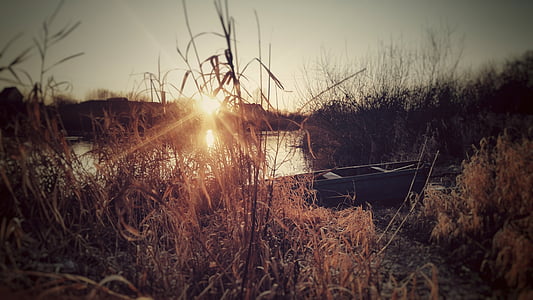 boat near body of water during golden hour thumbnail
