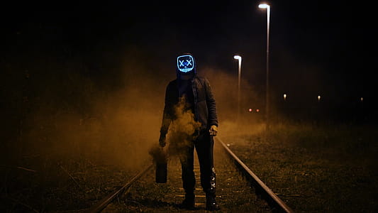 Man Wearing Black Jacket Standing On Railroad thumbnail