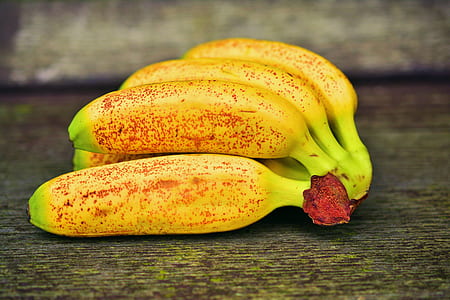 yellow banana on green wood thumbnail