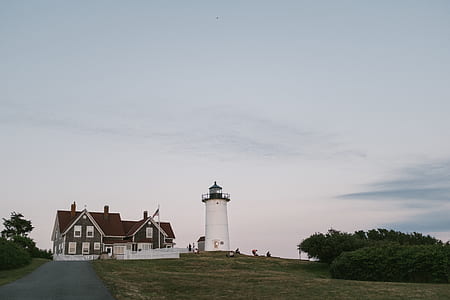 house near white lighthouse thumbnail