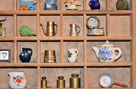 assorted-color pots on brown wooden shelf thumbnail