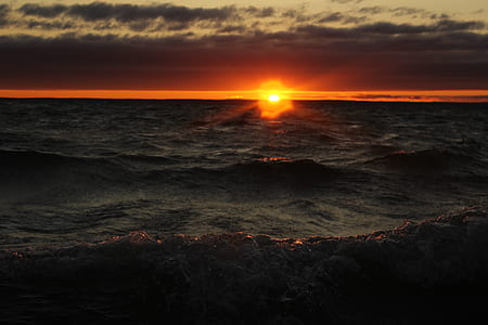 photo of body of water and sun thumbnail