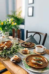 Breakfast served with tea, bread and eggs thumbnail