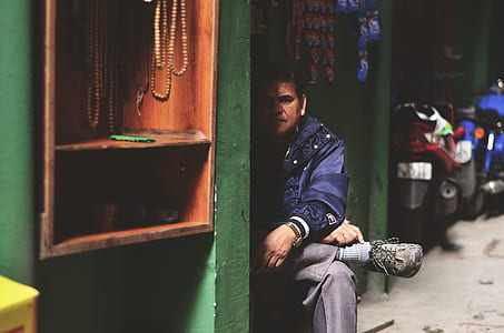 person looking at green wall thumbnail