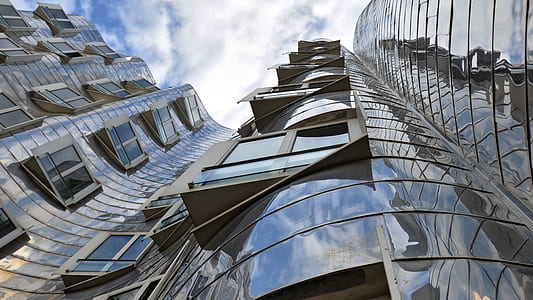 low angle photography of chrome building thumbnail