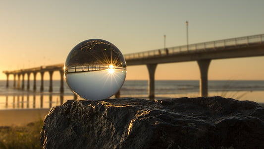 ball near bridge at sunset thumbnail
