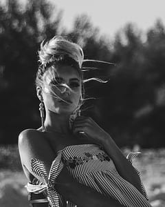 grayscale photo of woman with dress thumbnail