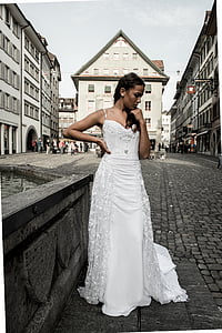 woman wearing wedding gown standing near fountain thumbnail