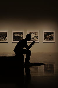 selective focus photo of man sitting on stair thumbnail
