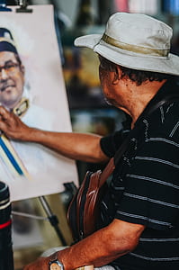 man painting during daytime thumbnail