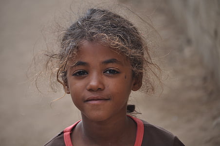shallow focus photo of girl in black and red top thumbnail