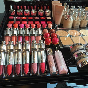 assorted makeup kit lot on black table thumbnail