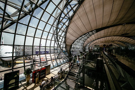 brown and gray painted airport during daytime thumbnail